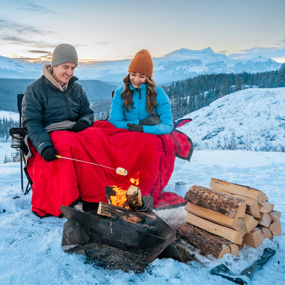 Mens and Womens Langtang Winter Jackets - Black and Light Blue - Winter Roasting Marshmallows on Campfire